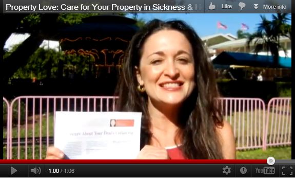 A woman holding up an envelope with the words care for your property in sickness and health.